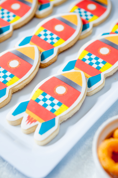 Kids space rocket party iced cookies