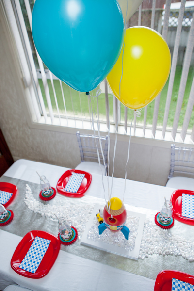 Kids space rocket party table setting from above