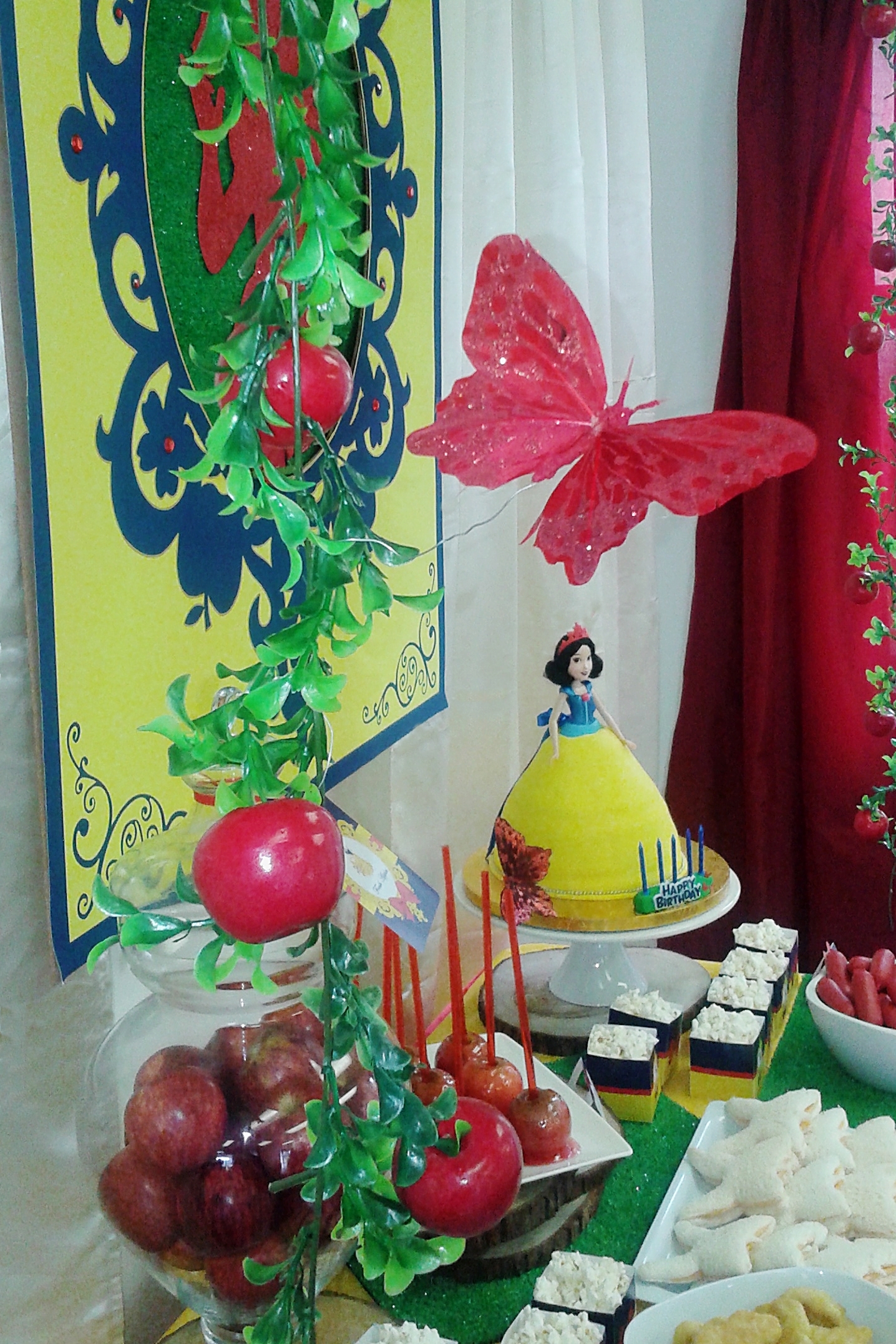 Snow White party buffet table with birthday cake