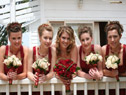 Bride and bridesmaids on balcony