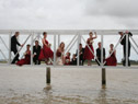 Bridal party on a bridge